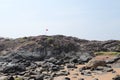 Rocks on Om Beach at Gokarna on a sunny day - Arabian sea - Indian beach holiday